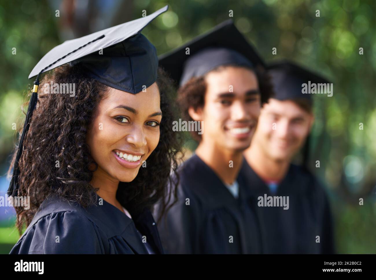 Bright young grads. Portrait of a diverse group of students on