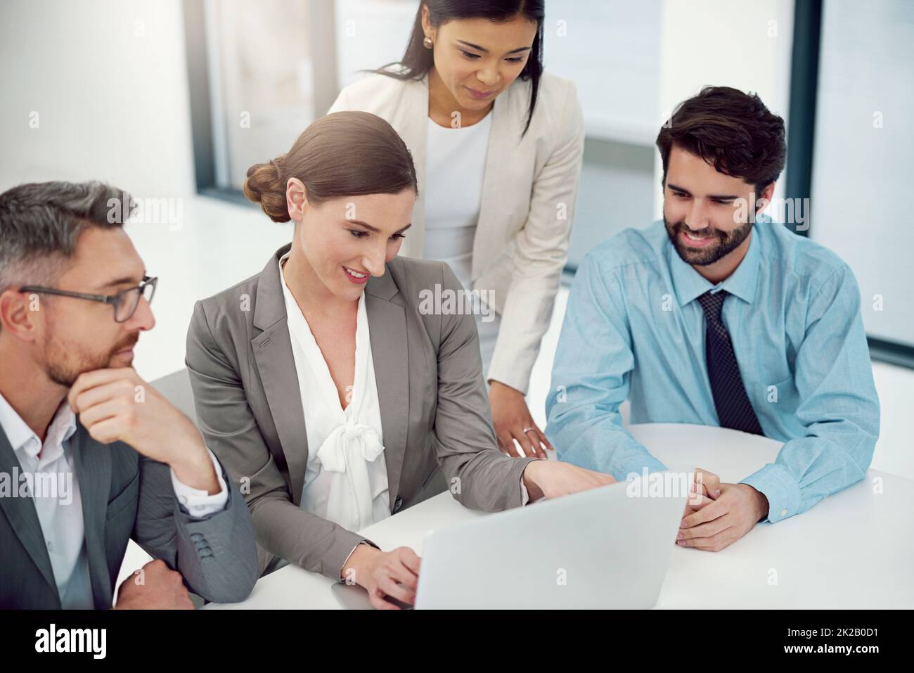 Redefining their proposal. Cropped shot of a group of businesspeople working together in a laptop in a modern office. Stock Photo
