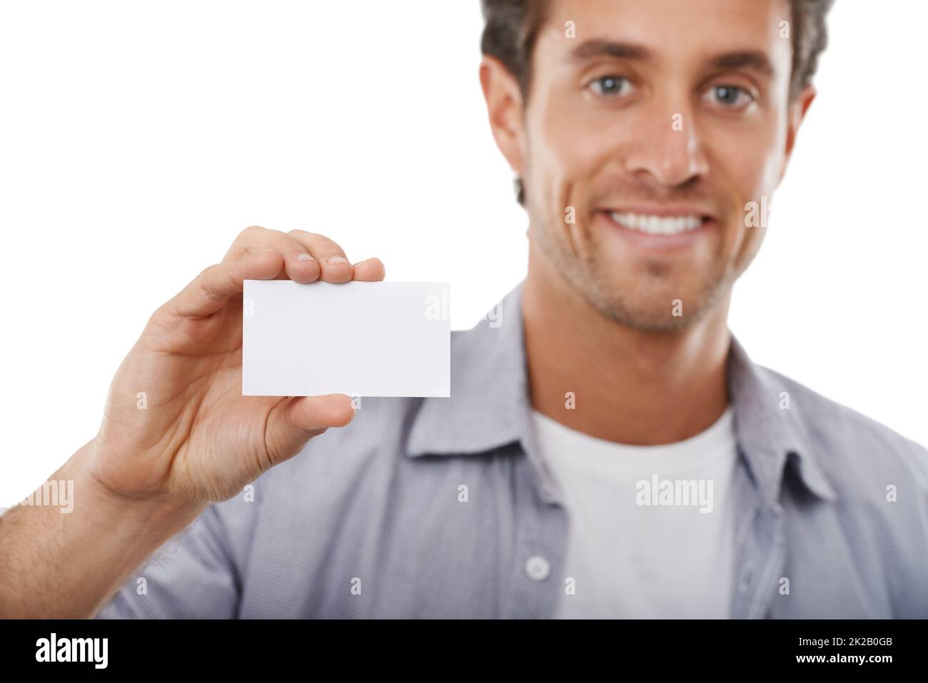 I just got these business cards made. Portrait of a handsome man holding up a business card of copyspace. Stock Photo