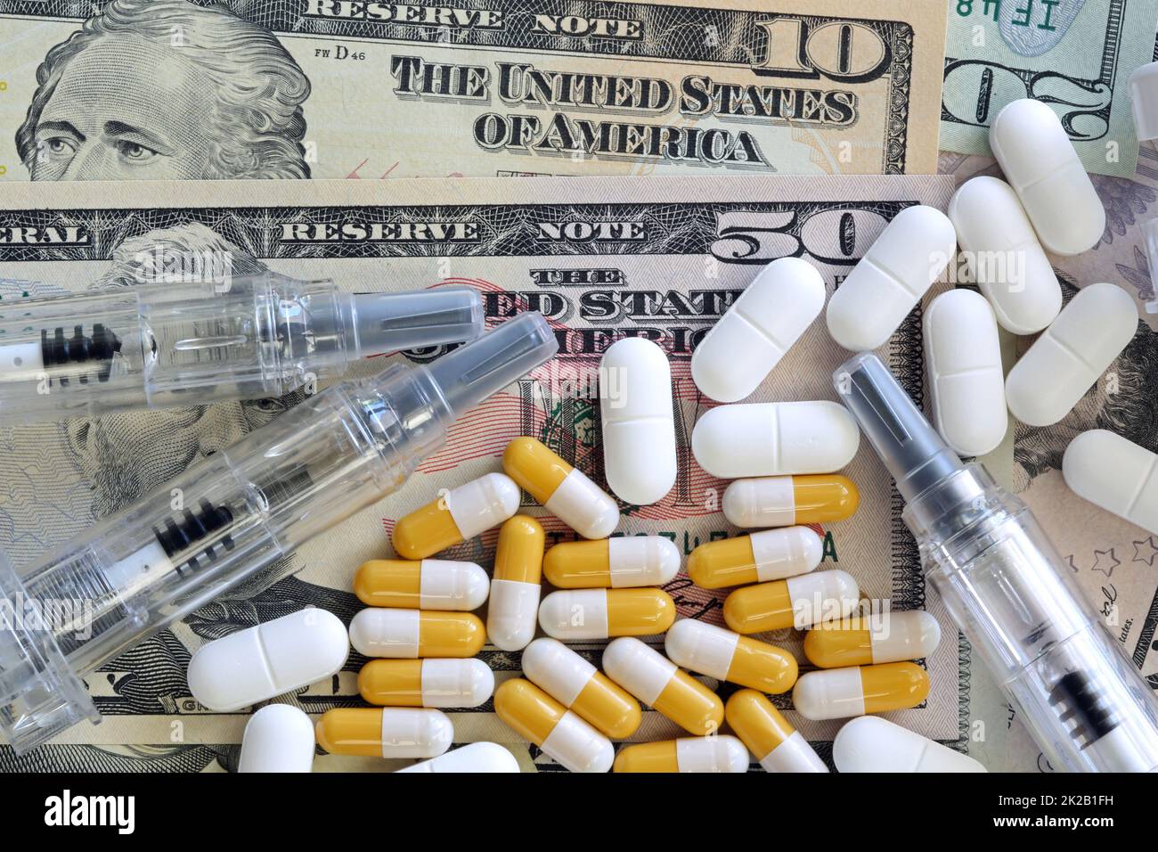 US Dollars with Pills and Syringe Stock Photo