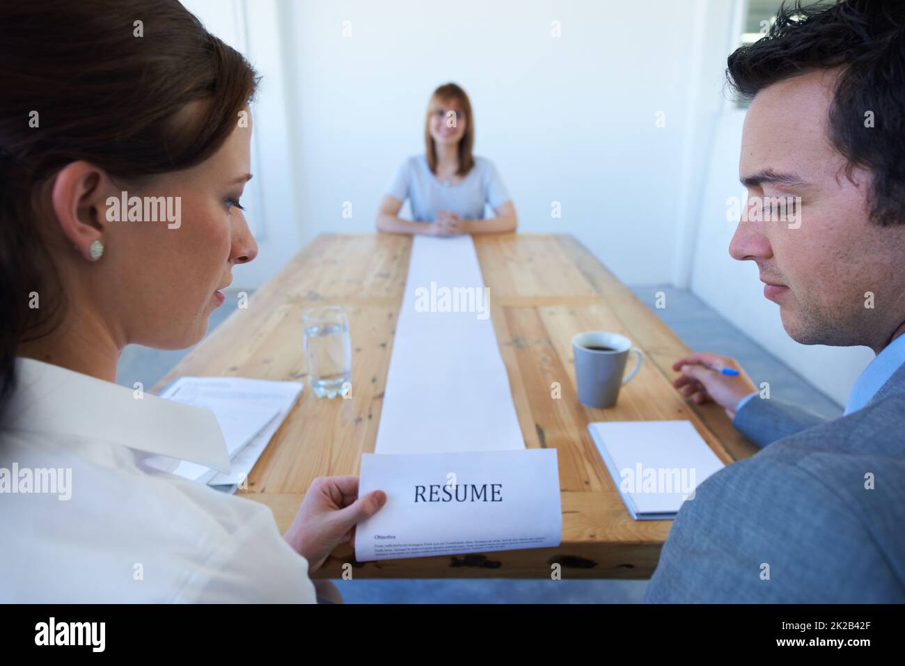This is exceptionally long.... Two employers astounded by the long resume a candidate has brought in to an interview. Stock Photo