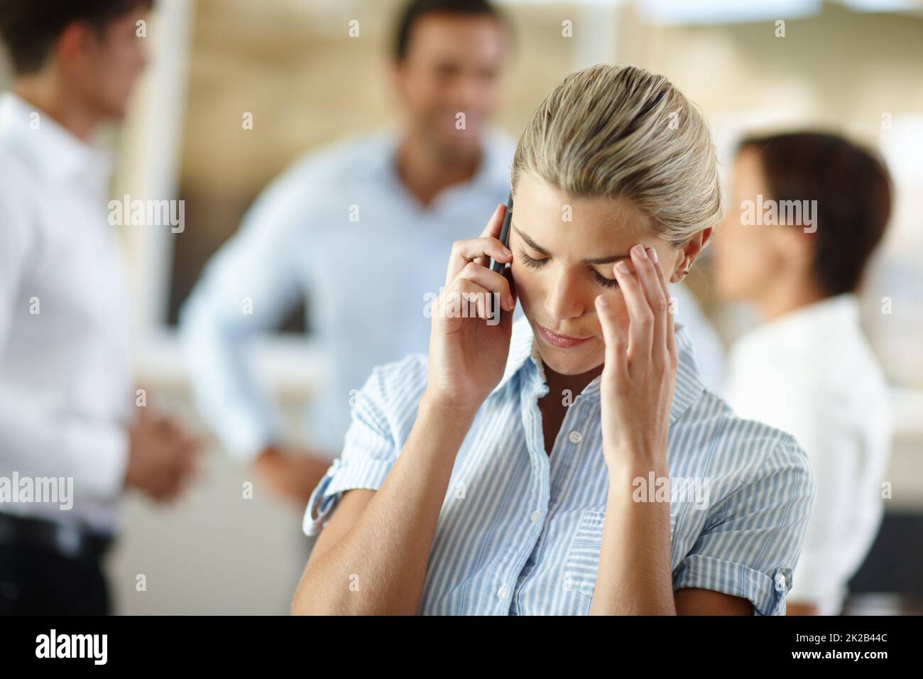Things just arent going her way today. Shot of a young businesswoman looking dismayed after receiving bad news on the phone. Stock Photo