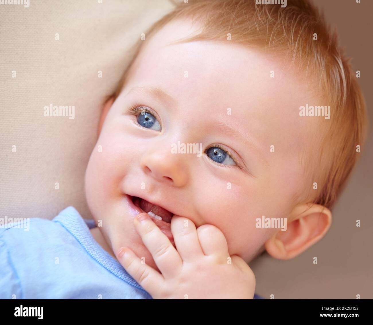 Growing up in the safety of home. Closeup shot of an adorable baby boy in his home. Stock Photo