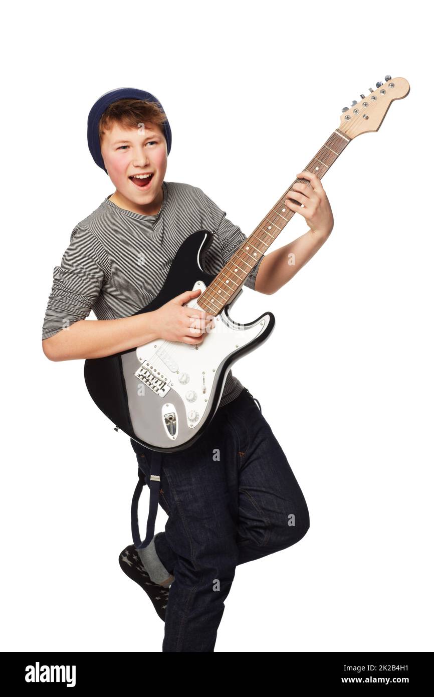 Rockin out. A teenage boy playing a n electric guitar. Stock Photo