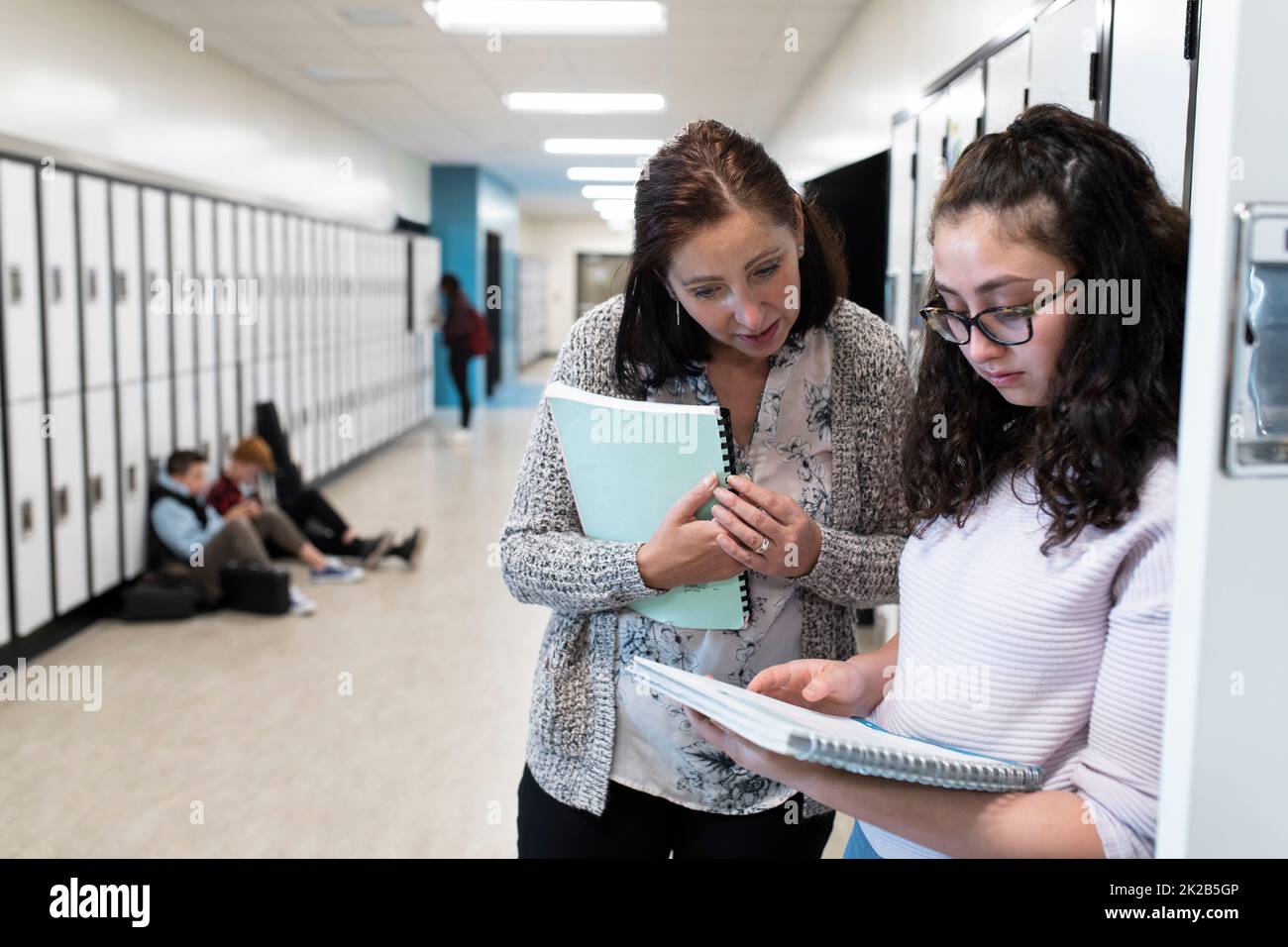 Teacher and student talking about book hi-res stock photography and ...