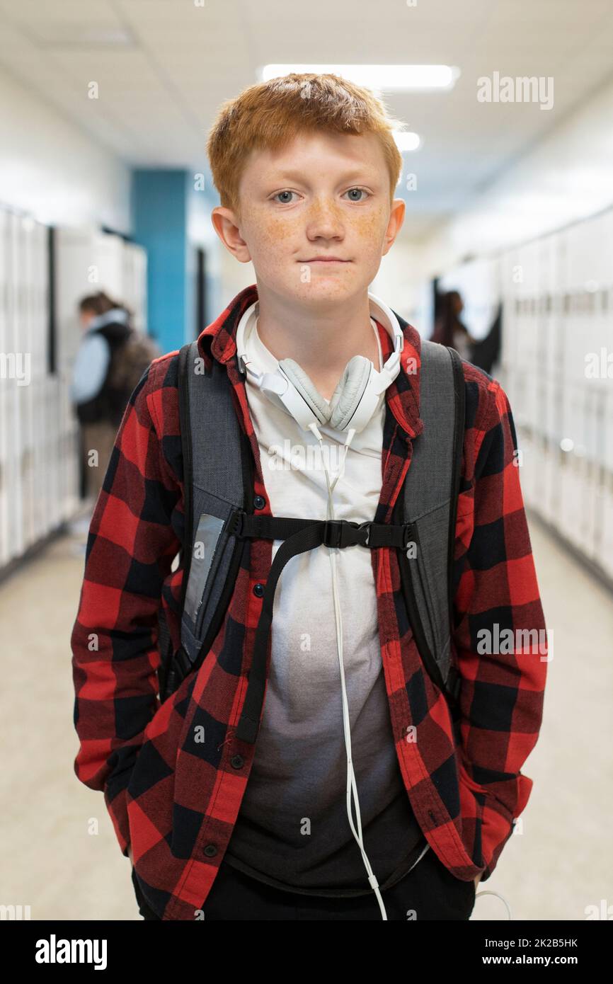 Student wearing backpack in school corridor Stock Photo Alamy