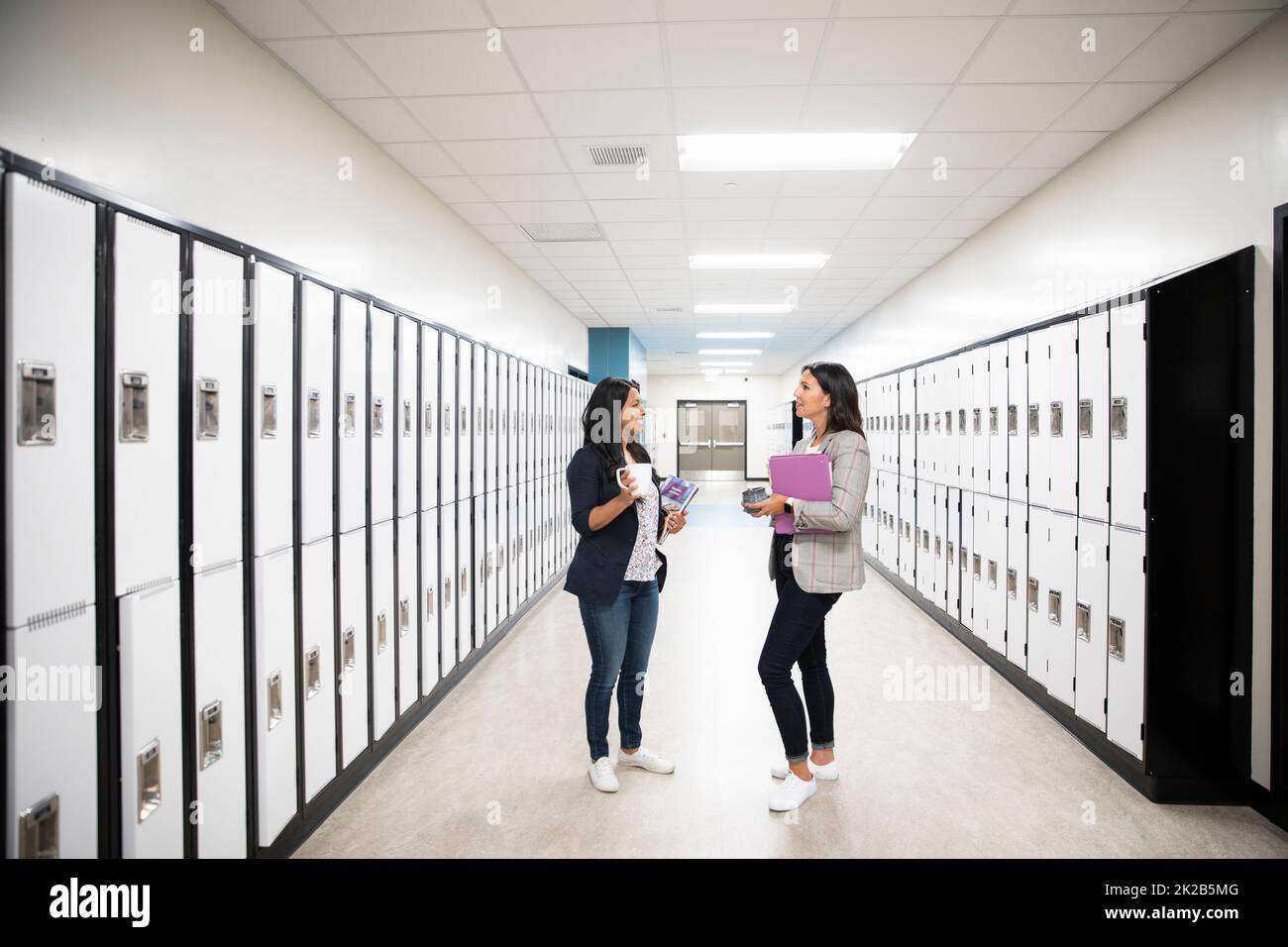 Teachers talking corridor hi-res stock photography and images - Alamy