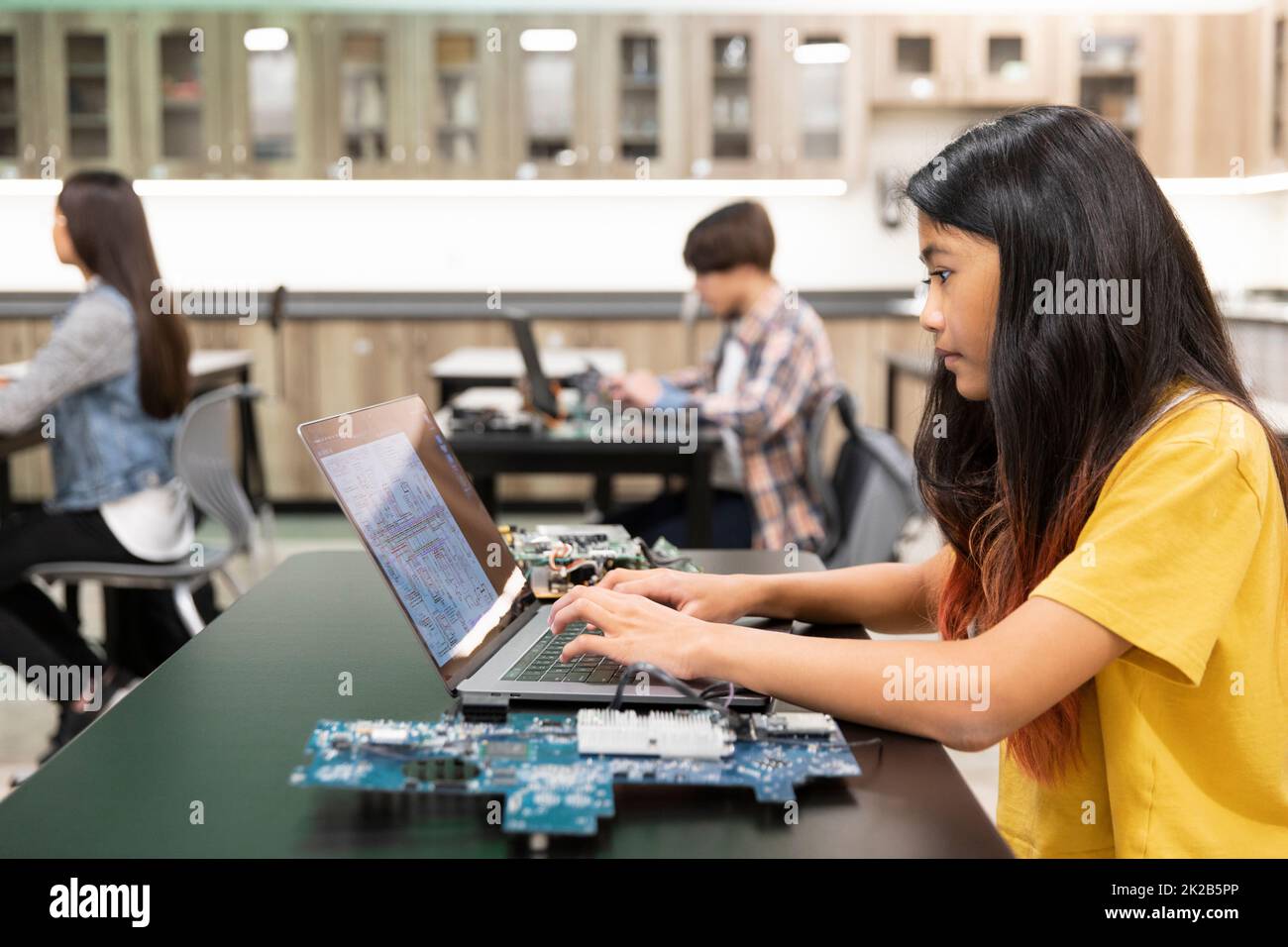 Group working on laptops hi-res stock photography and images - Alamy