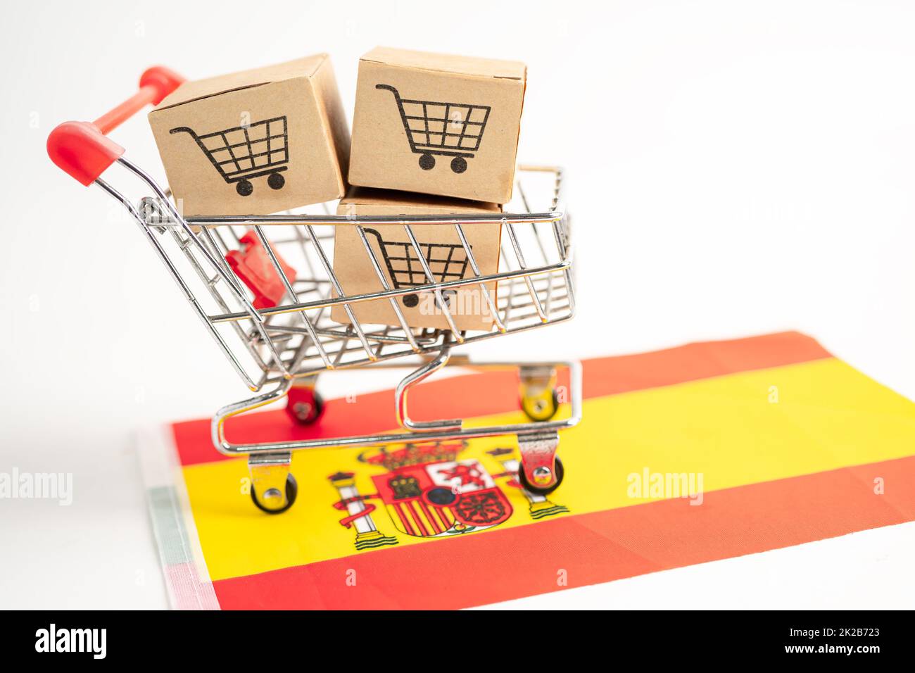 Box with shopping cart logo and Spain flag, Import Export Shopping