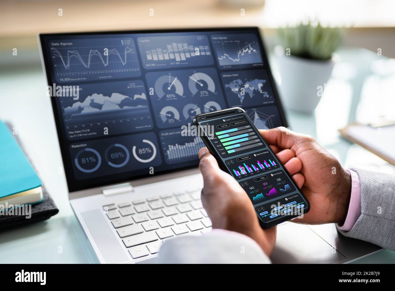 African Advisor Using KPI Dashboard Stock Photo