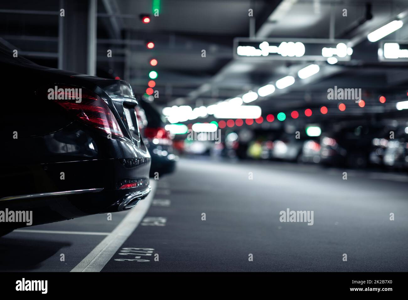 Underground garage or modern car parking with lots of vehicles Stock Photo