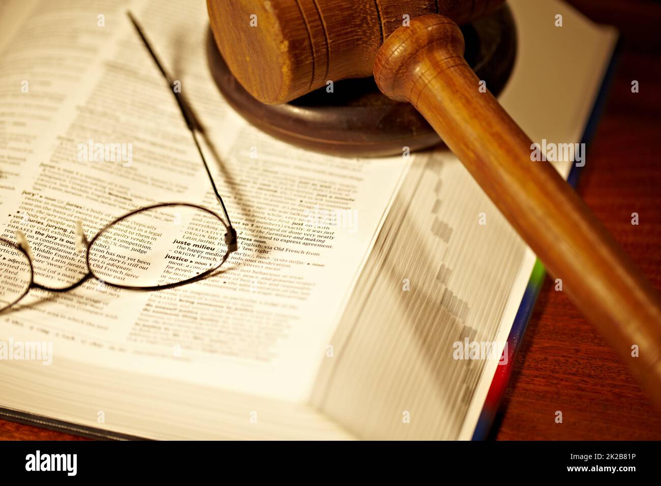 The meaning of justice. An open book with a gavel and block justice Stock Photo Alamy