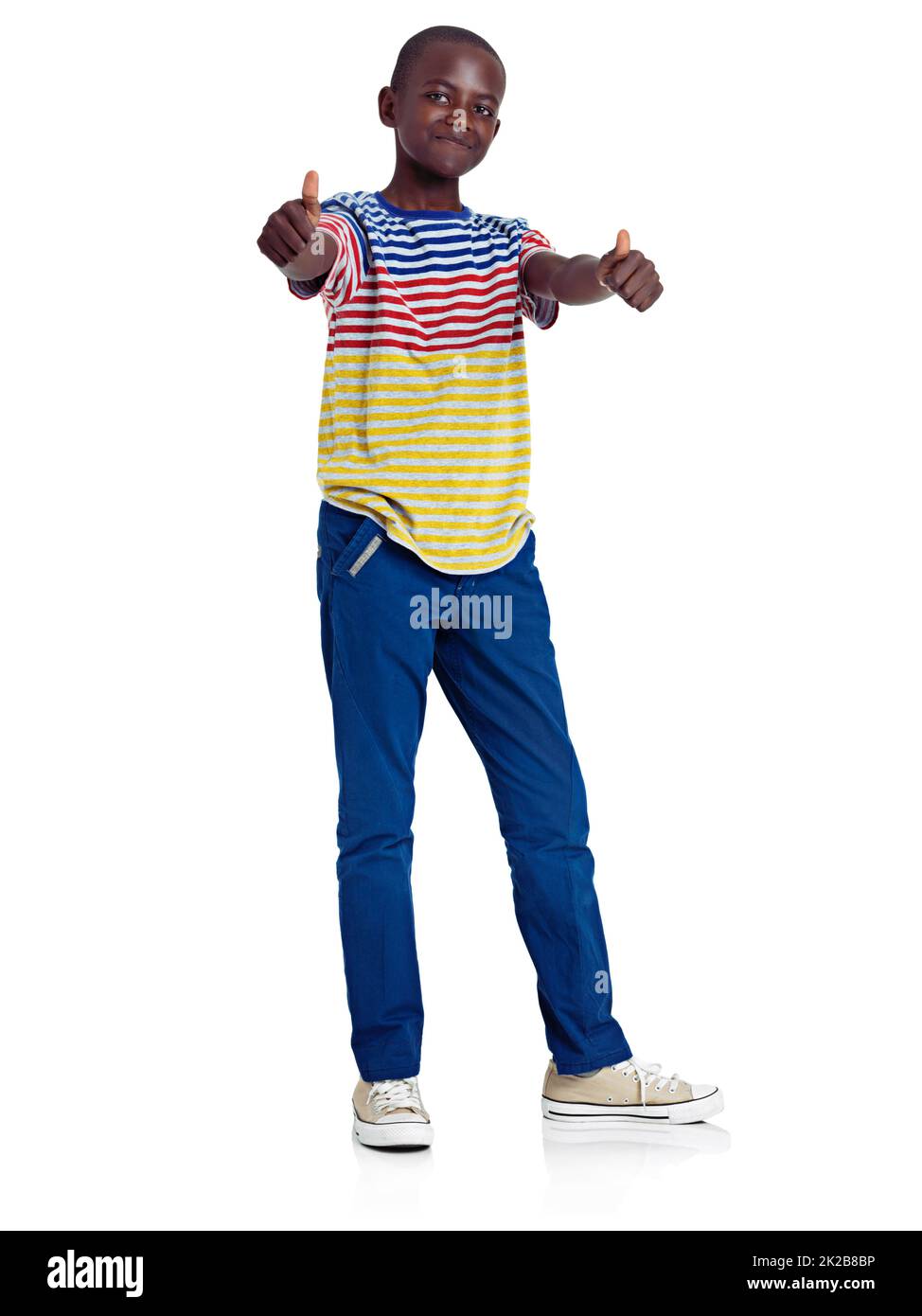 Its a definite Yes. Full length studio shot of an african teenage boy giving a double thumbs up in front of a white background. Stock Photo