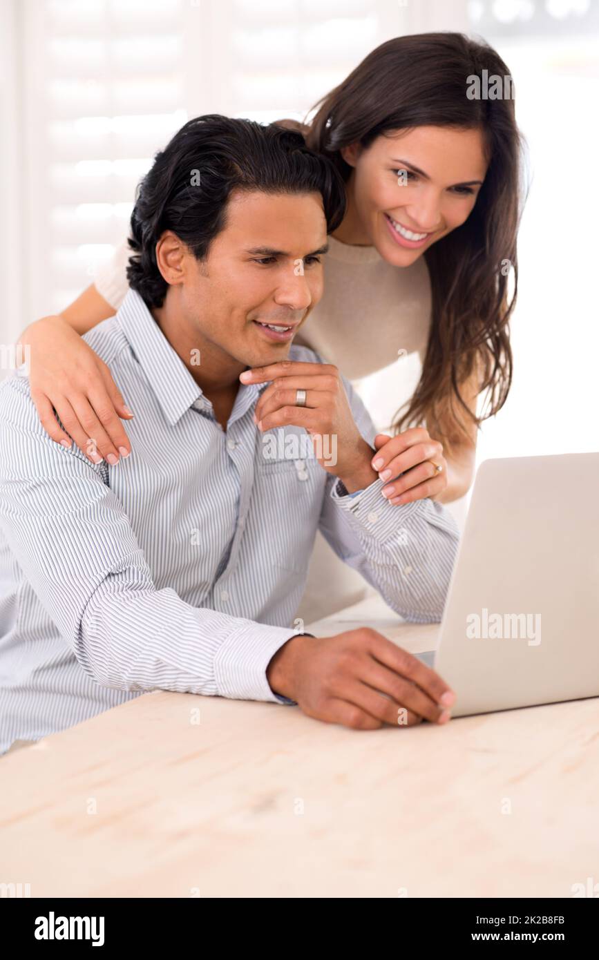 Look at this cute video I found on the web.... A husband and wife looking at something on a laptop screen. Stock Photo