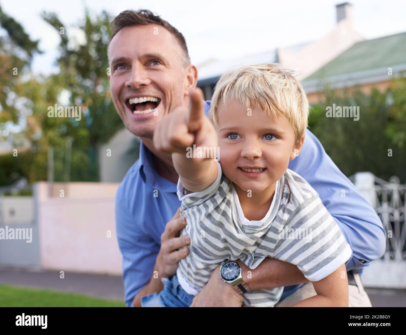 Enjoying time as a family. A father playing with his child. Stock Photo