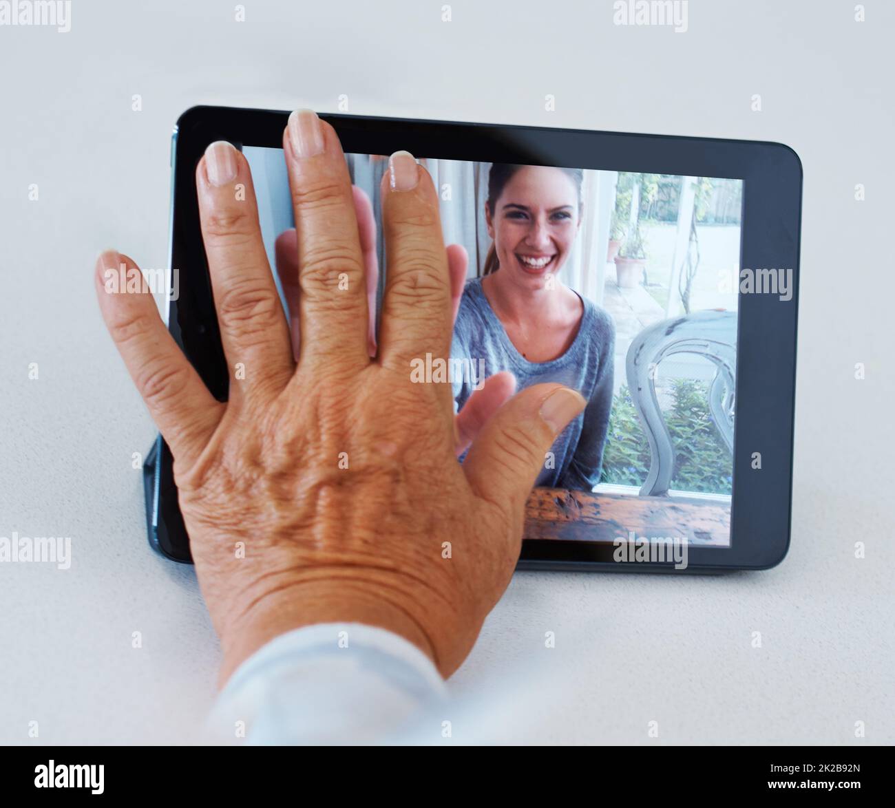 I miss you too. Shot of a grandmother longing for her grandchild while video conferencing. Stock Photo