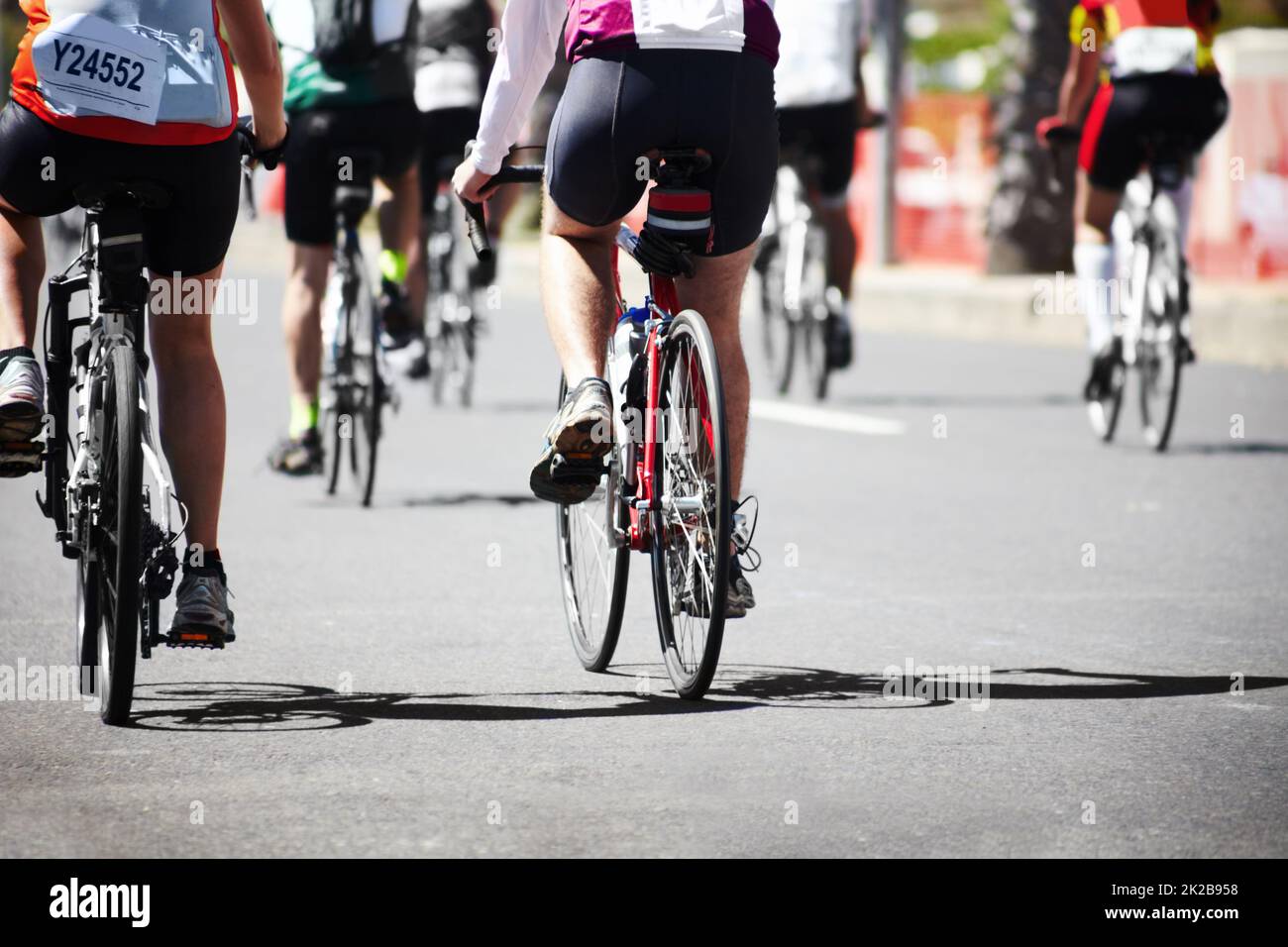 Its about the journey. A group of cyclers out on the road during a cycle tour. Stock Photo