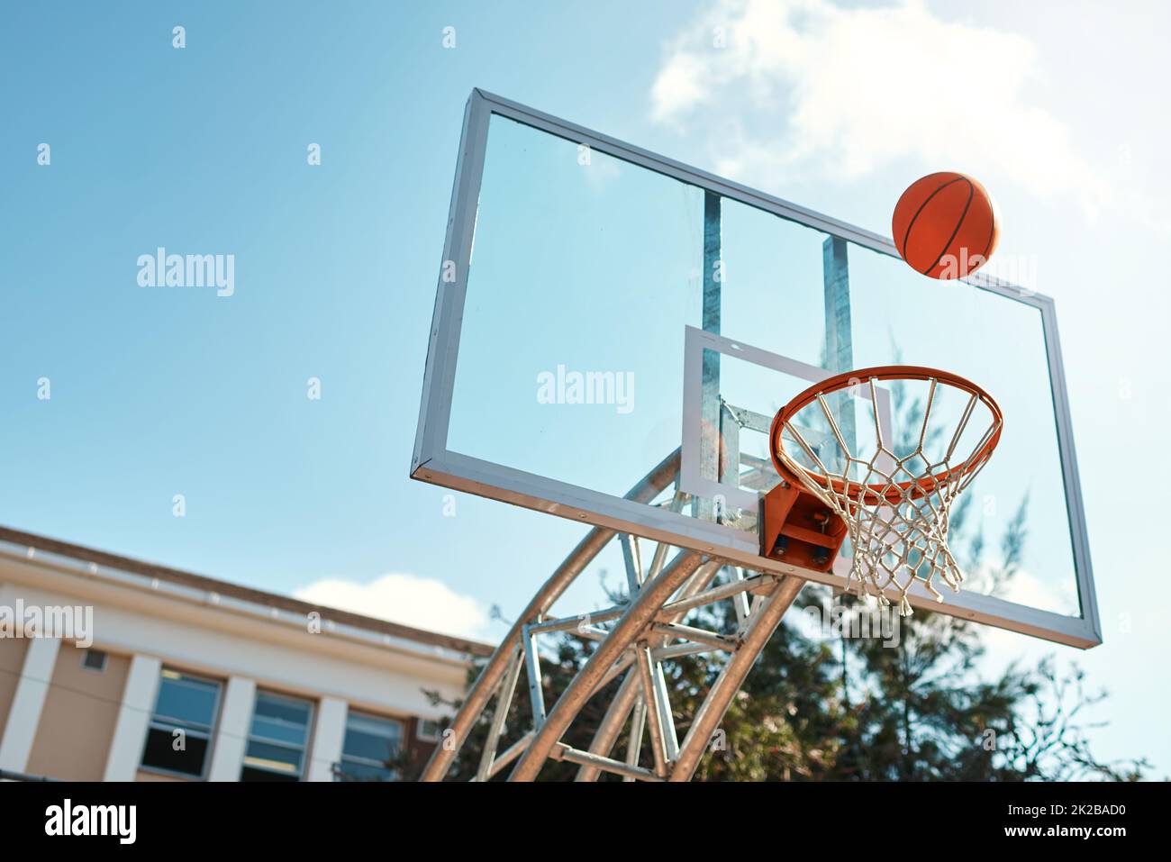 Thats going to be an airball shot. Still life shot of a basketball landing into a net on a