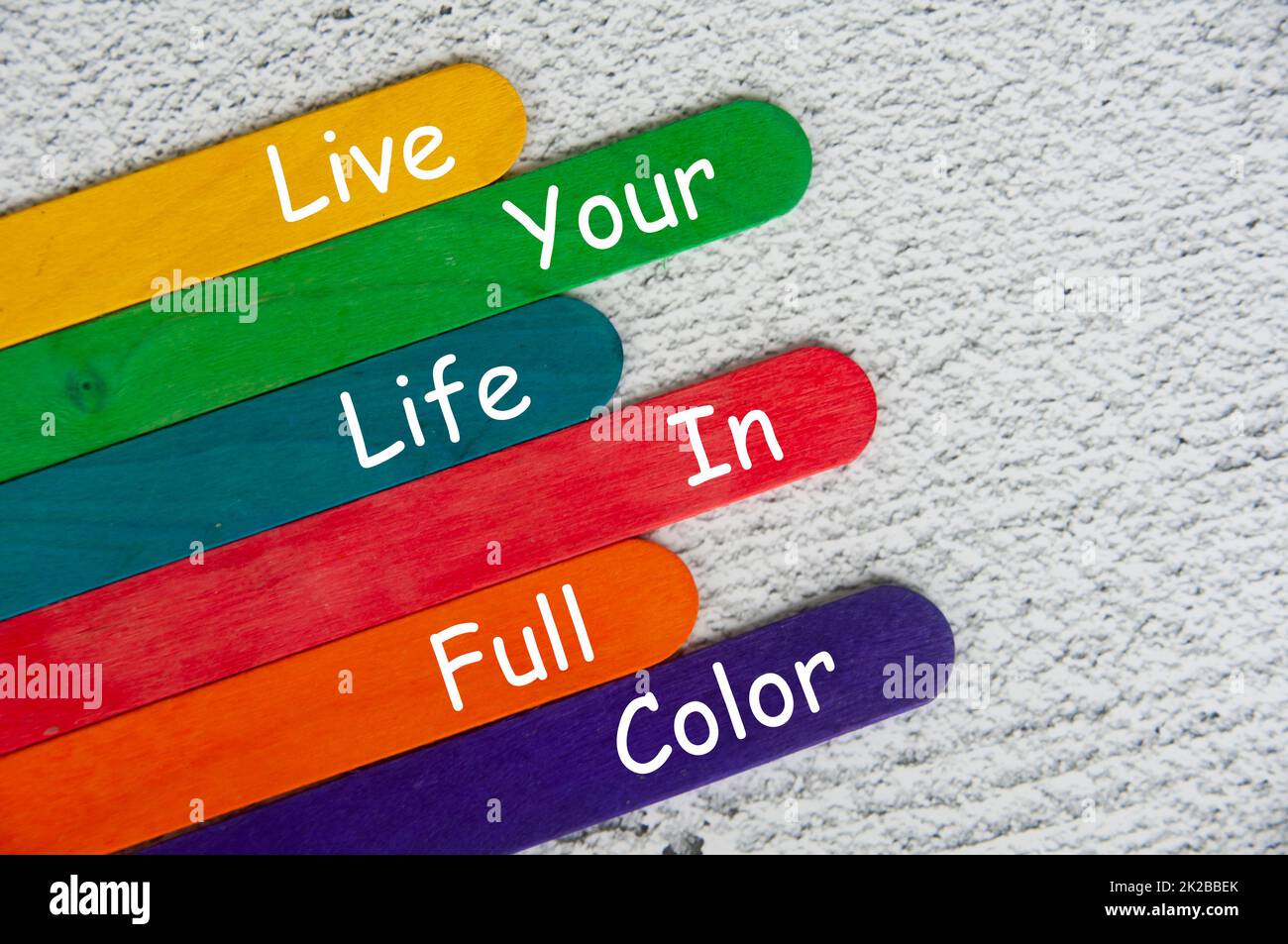 live your life in full color text on color sticks. Motivational concept ...