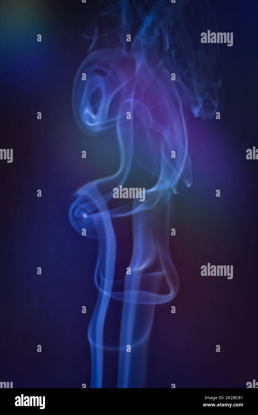 Smoky clouds on blue and black background Stock Photo