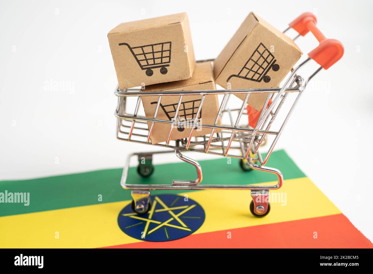 Box with shopping cart logo and Ethiopia flag, Import Export Shopping online or eCommerce finance delivery service store product shipping, trade, supplier concept. Stock Photo