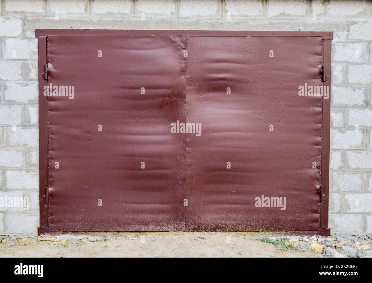 Iron gates on the garage. Brown gates made of steel Stock Photo Alamy