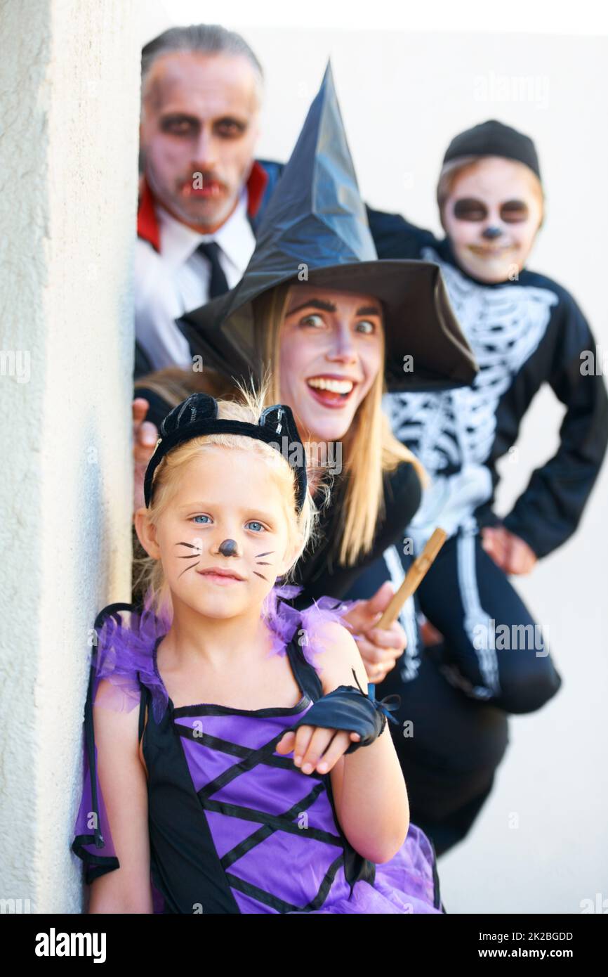 Theyre coming for you. A family dressed up for Halloween together. Stock Photo