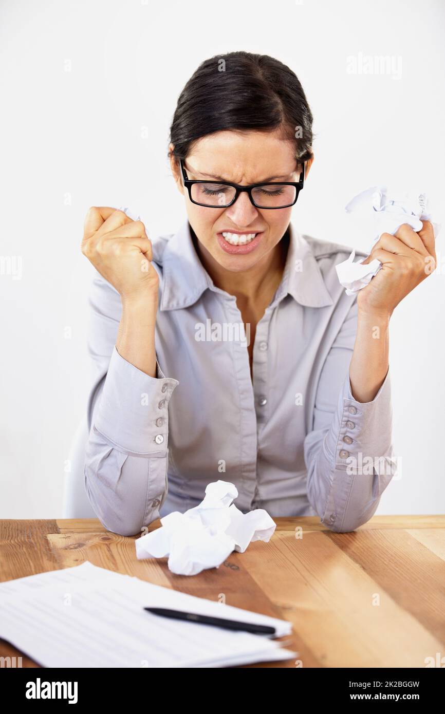 This isnt working. Frustrated young businesswoman struggling to come up with ideas. Stock Photo