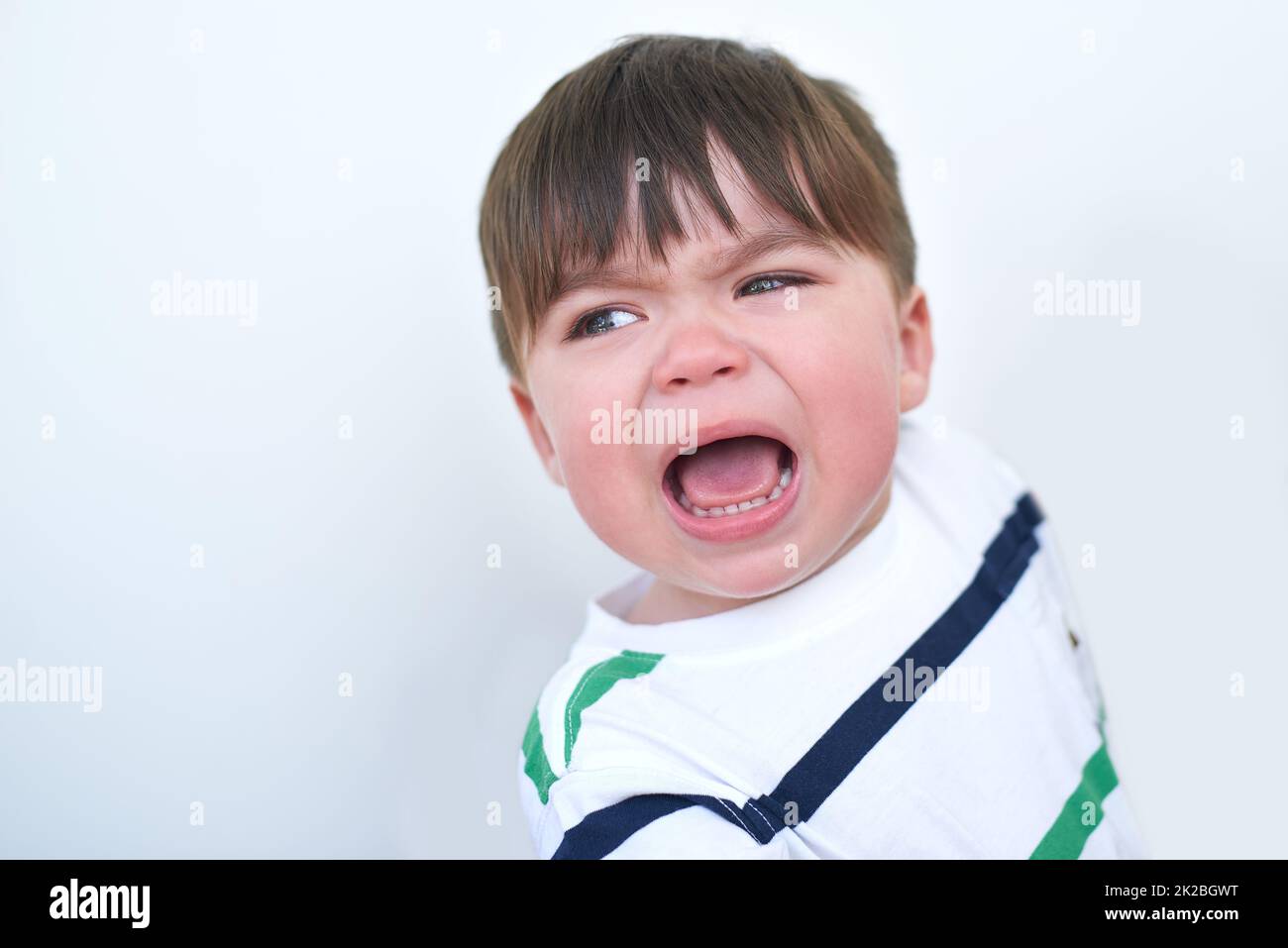 I want my mommy. Shot of an unhappy baby boy crying alone. Stock Photo