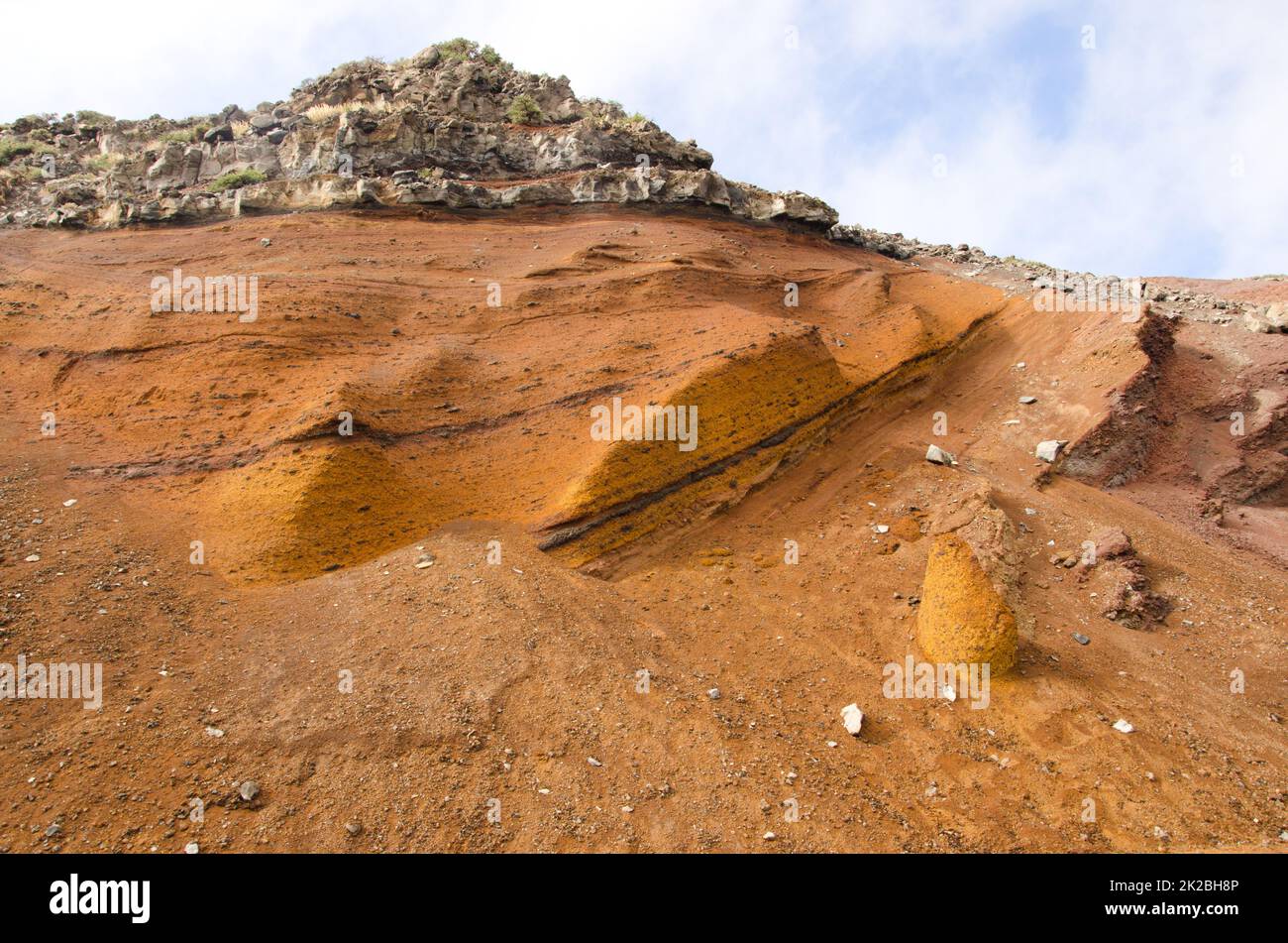 Hill with volcanic tuff and basaltic rock. Stock Photo