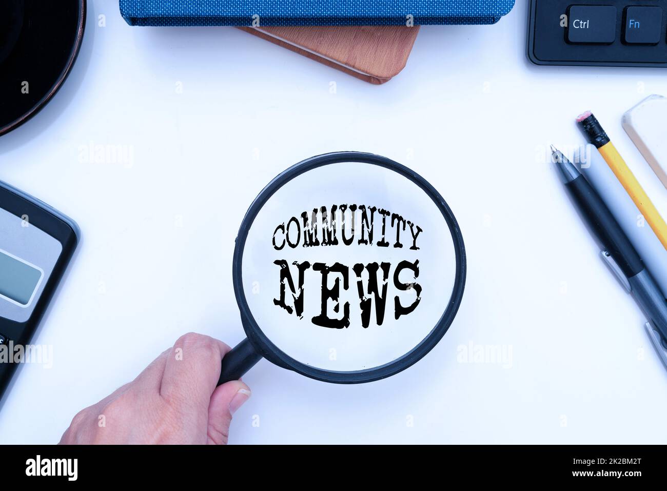 Inspiration showing sign Community News. Business idea news coverage that typically focuses on city neighborhoods Office Supplies Over Desk With Keyboard And Glasses And Coffee Cup For Working Stock Photo