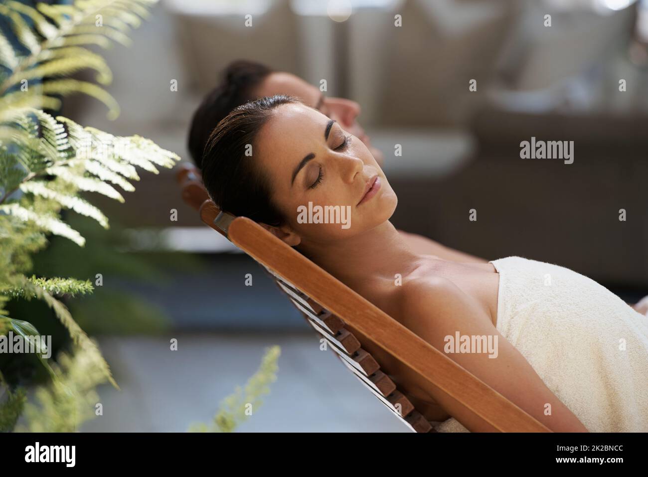 Peace and calm in luxury. Cropped shot of a mature couple relaxing side by side on lounge chairs outside. Stock Photo