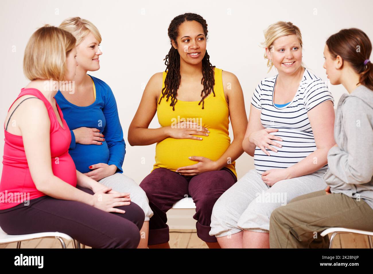 Discussing their hopes and dreams. A group of pregnant women sitting down together to share their feelings. Stock Photo