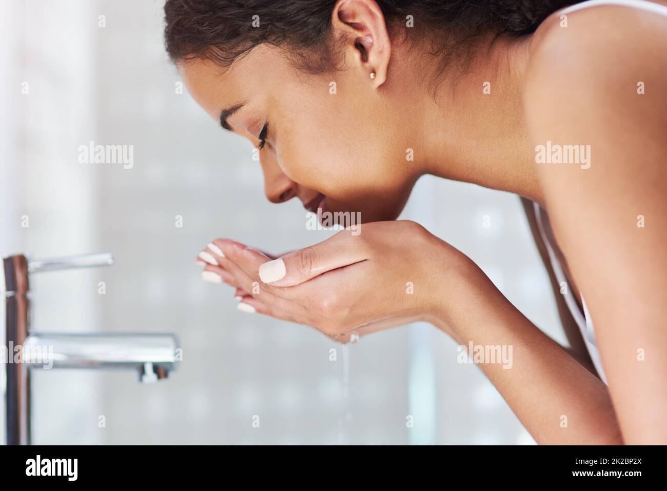 One woman only, washing face hi-res stock photography and images - Alamy
