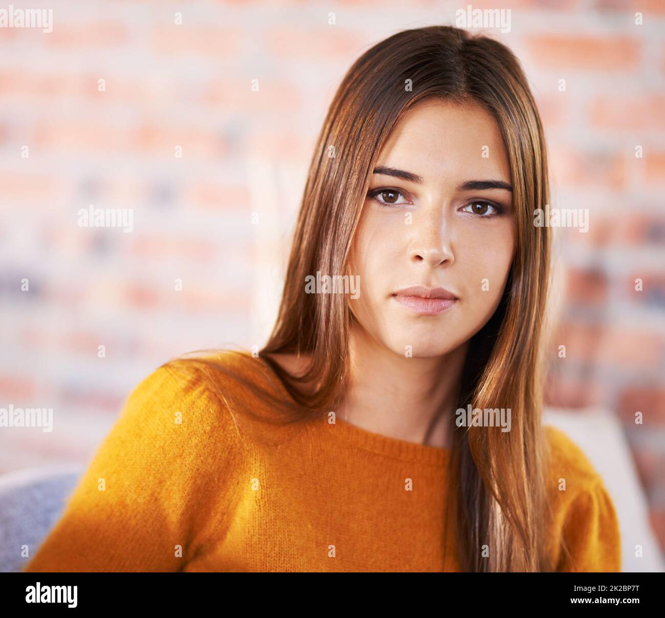 All dressed up and nowhere to go. A young woman inside her house. Stock Photo