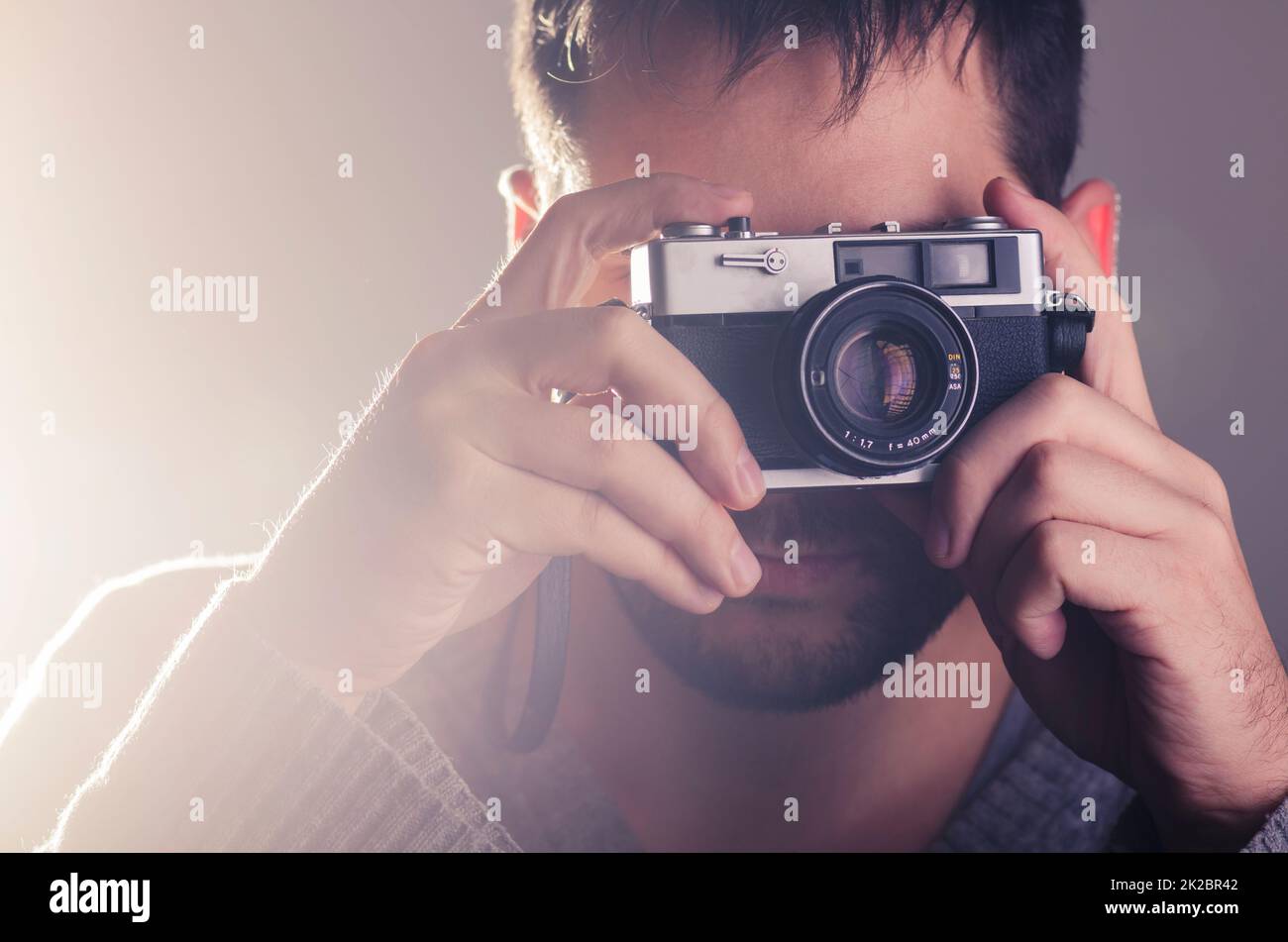 Man holiding retro camera Stock Photo