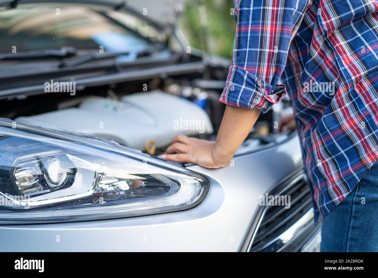 Open hood mechanic engine system to check and repair damage car crash
