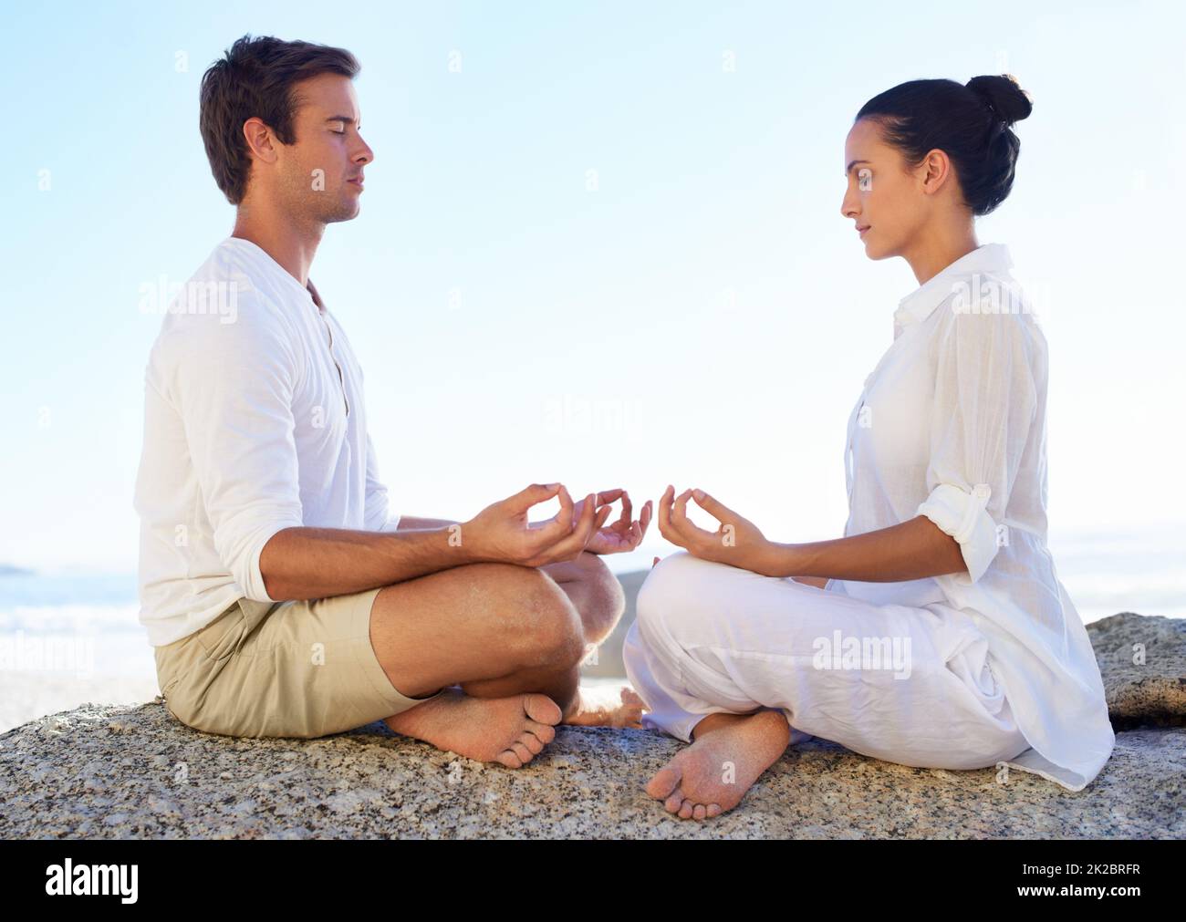 Helping each other peace and tranquility. A young couple performing a