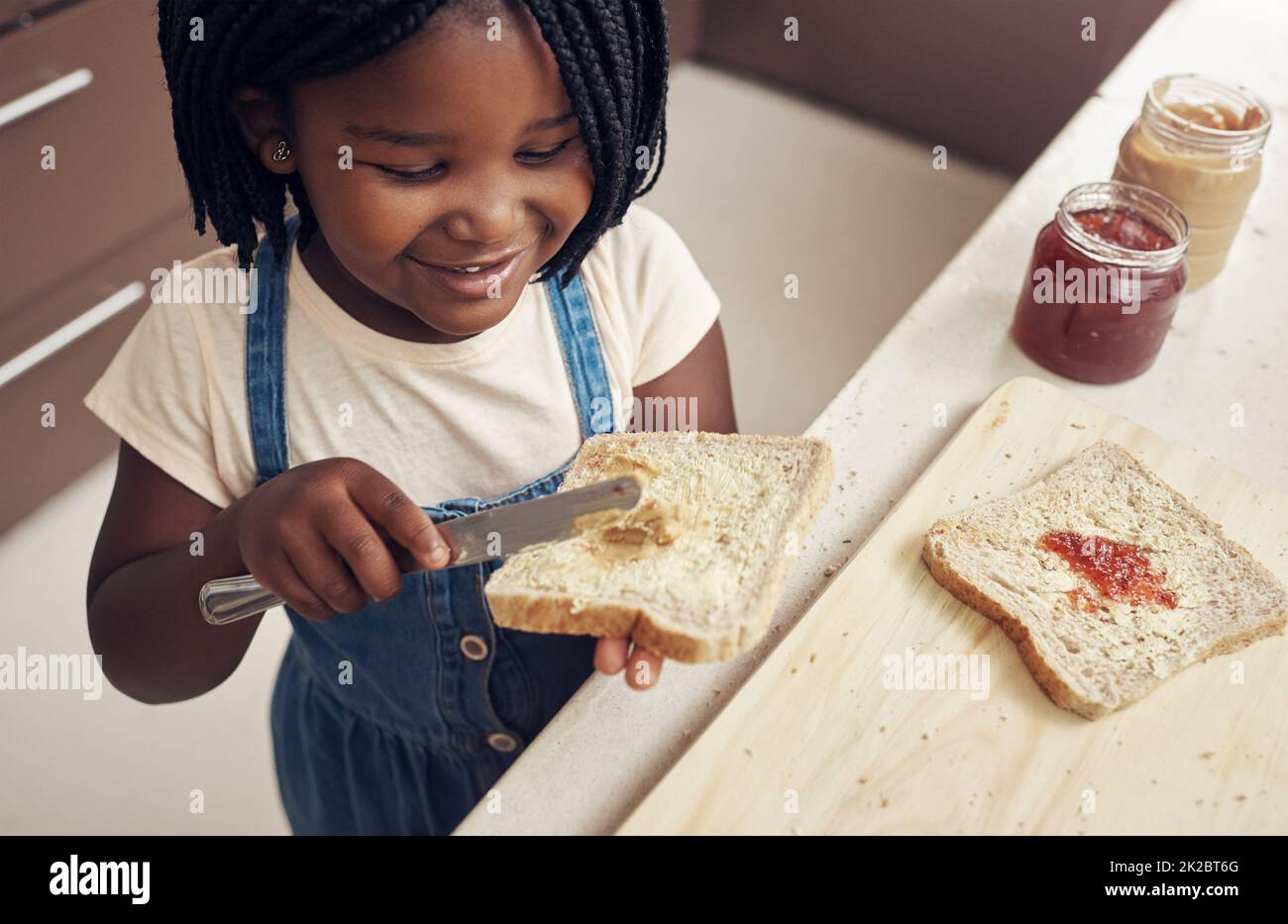 I make sure my bread is buttered on both sides. Cropped shot of an