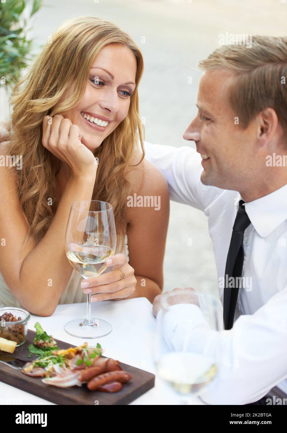 Hes everything I want. A woman enjoying her boyfriends company in a restaurant. Stock Photo