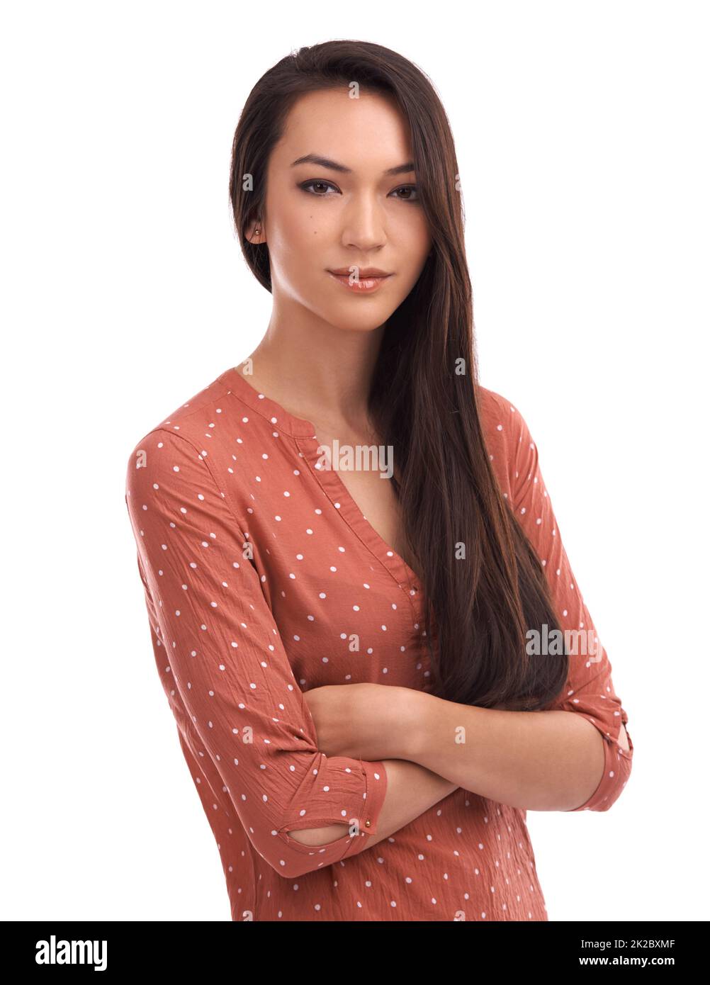 Cooly confident. Studio portrait of a confident young woman with her arms crossed. Stock Photo