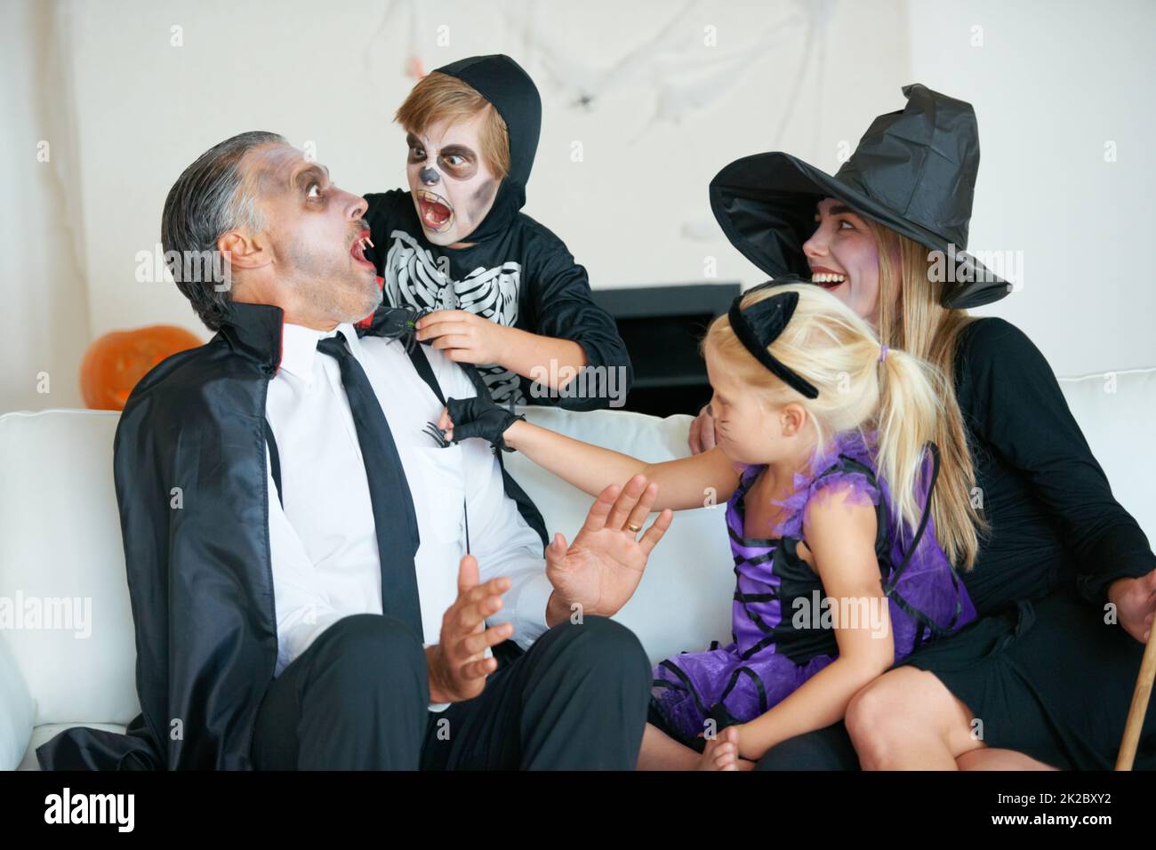 Best time of the year for frights. A cute family dressed up for 