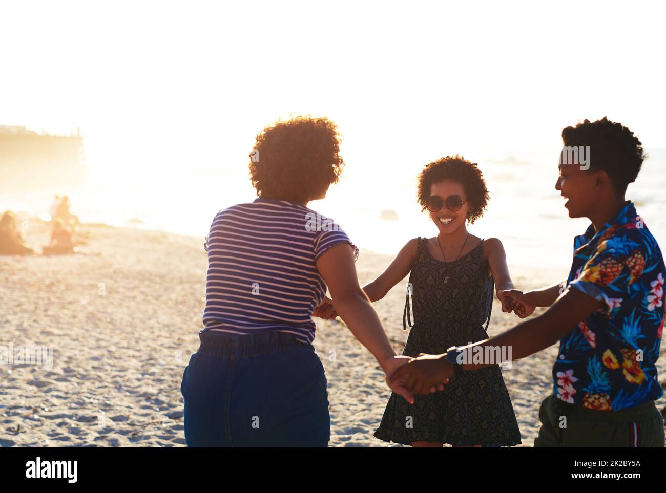 Friends make the world a better place. Cropped shot of an attractive young trio of women enjoying a day out together on the beach during the day. Stock Photo