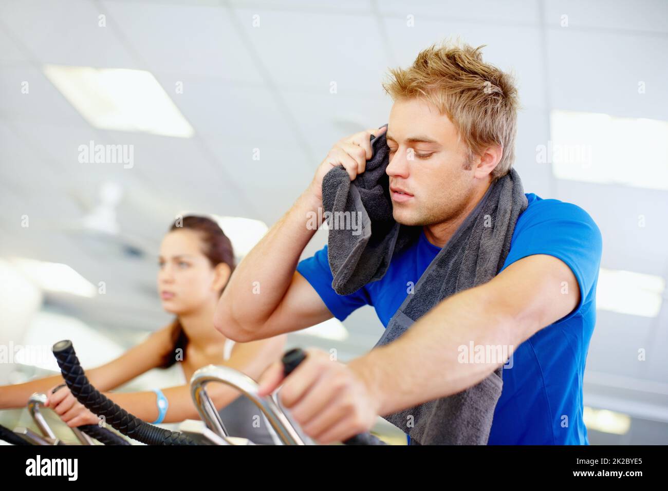working-out-young-man-tired-while-cycling-at-the-gym-stock-photo-alamy