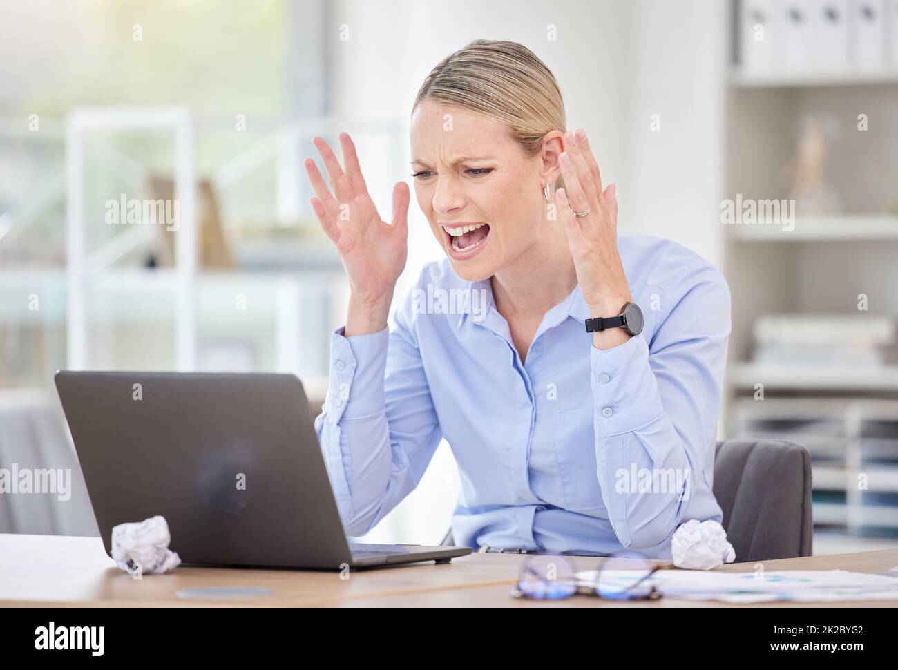 Laptop accident, angry and business woman with anxiety about work email, stress about startup company review and mental health problem in office Stock Photo