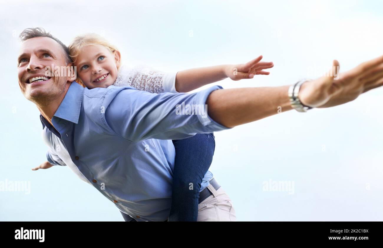 Enjoying time as a family. A father playing with his child. Stock Photo