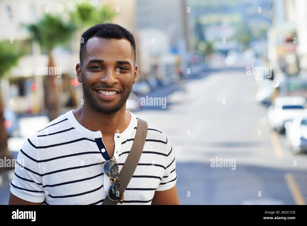 Positivity defines him. A handsome african american businessman out in the city while on his way to work. Stock Photo