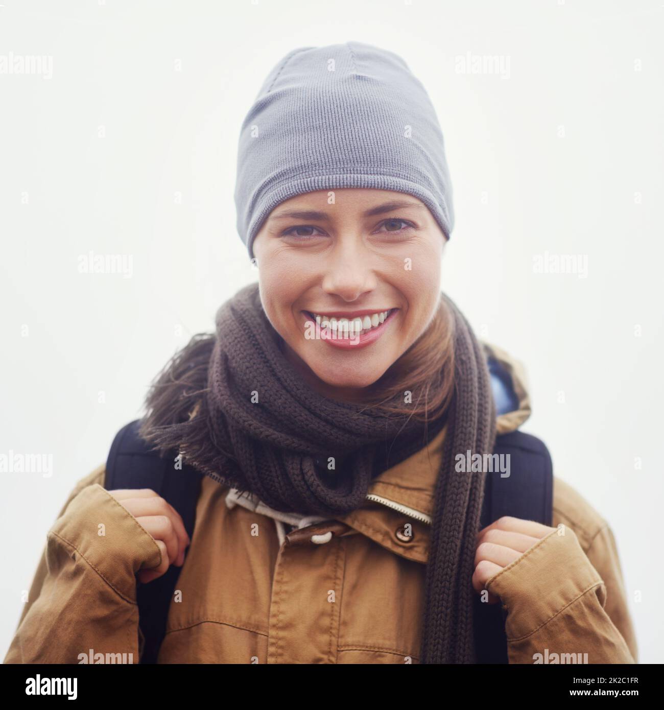 I love hiking. Closeup portrait of an attractive young woman out hiking on an overcast day. Stock Photo