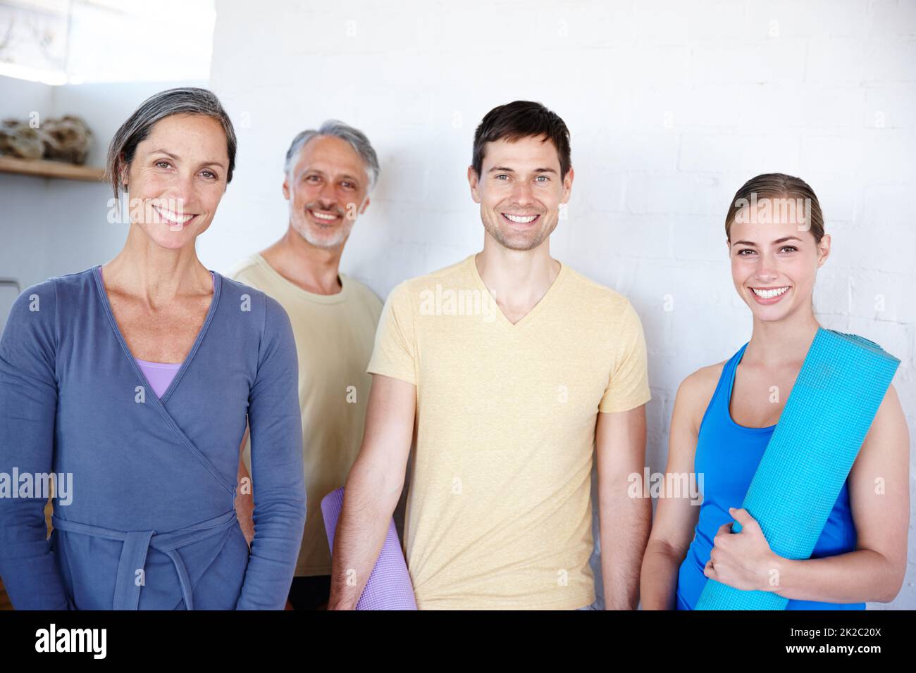 That was good. A group of people tstanding together after gym class. Stock Photo