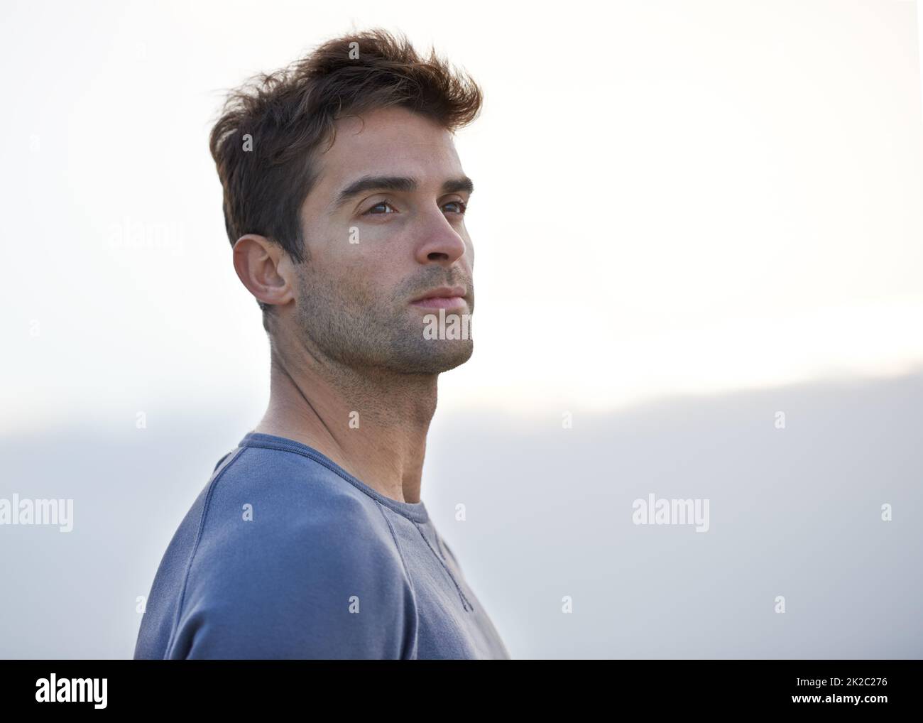 Finding inspiration. A handsome young man looking away thoughtfully. Stock Photo